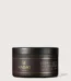 Dark brown Hadat cosmetics jar labeled Hydro Liquid Silk Treatment with black lid, gold branding on a light background, product for hair repair.