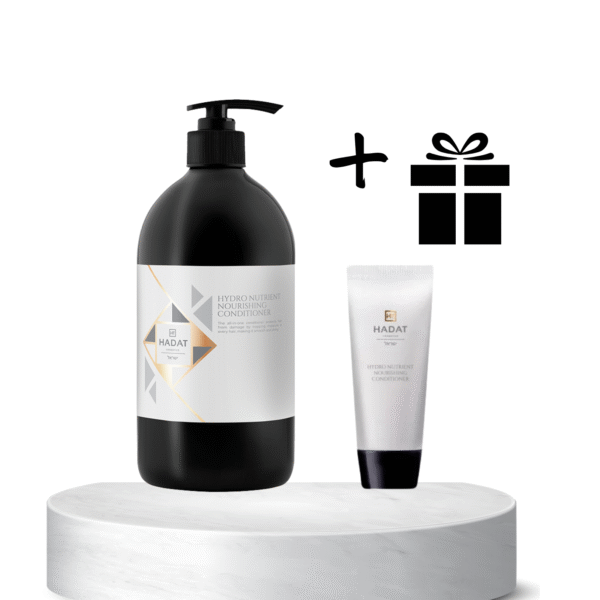 Large black pump bottle of conditioner on a white pedestal, beside a small tube and a gift icon indicating a bundle.