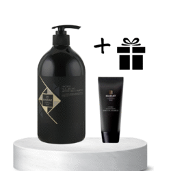 Hydro Nourishing Moisture Shampoo bottle with pump beside a smaller tube and a gift icon on a white pedestal, against a white background.
