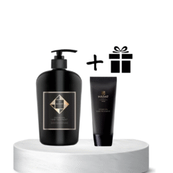 Hadat hydro spa hair treatment duo (pump bottle and tube) displayed on a white pedestal with a gift icon above, suggesting a gift set promotion