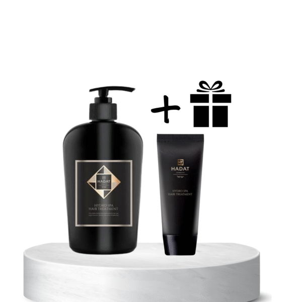 Hadat hydro spa hair treatment duo (pump bottle and tube) displayed on a white pedestal with a gift icon above, suggesting a gift set promotion