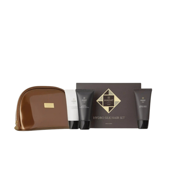 Hydro Silk Hair Set packaging with black tubes and a gold diamond box in front of a brown leather case