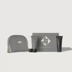 Hadat Hydro Hair Growth Set products with a gray zipper bag in the foreground.