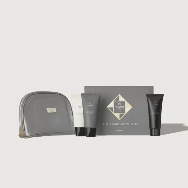 Hadat Hydro Hair Growth Set products with a gray zipper bag in the foreground.