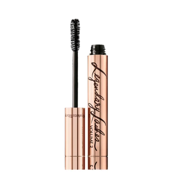 Rose-gold mascara tube with its wand lifted beside it, on a white background.