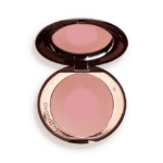 Open round makeup compact with pink pressed powder blush and mirror reflection inside.