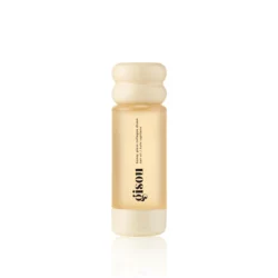 Small amber bottle of hair oil with a cream wavy cap, labeled collagen drops on a white background
