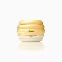Gisou honey gloss ceramide therapy hair mask jar in a yellow gradient with a ribbed, rounded container.