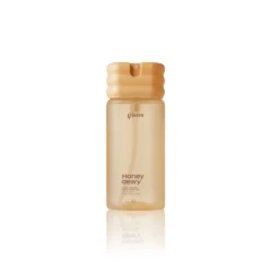 Gisou Honey Dewy bottle, gold-hued hair and body mist with a wavy cap, standing upright with reflection below