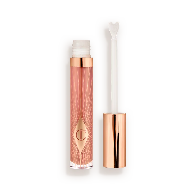 Pillowtalk_Collagen-Lip-Bath-Open-Packshotpng - shopcosmoprof.com Lip gloss tube with a rose-gold cap and pink patterned container, shown with the applicator wand outside the tube in a neutral background.
