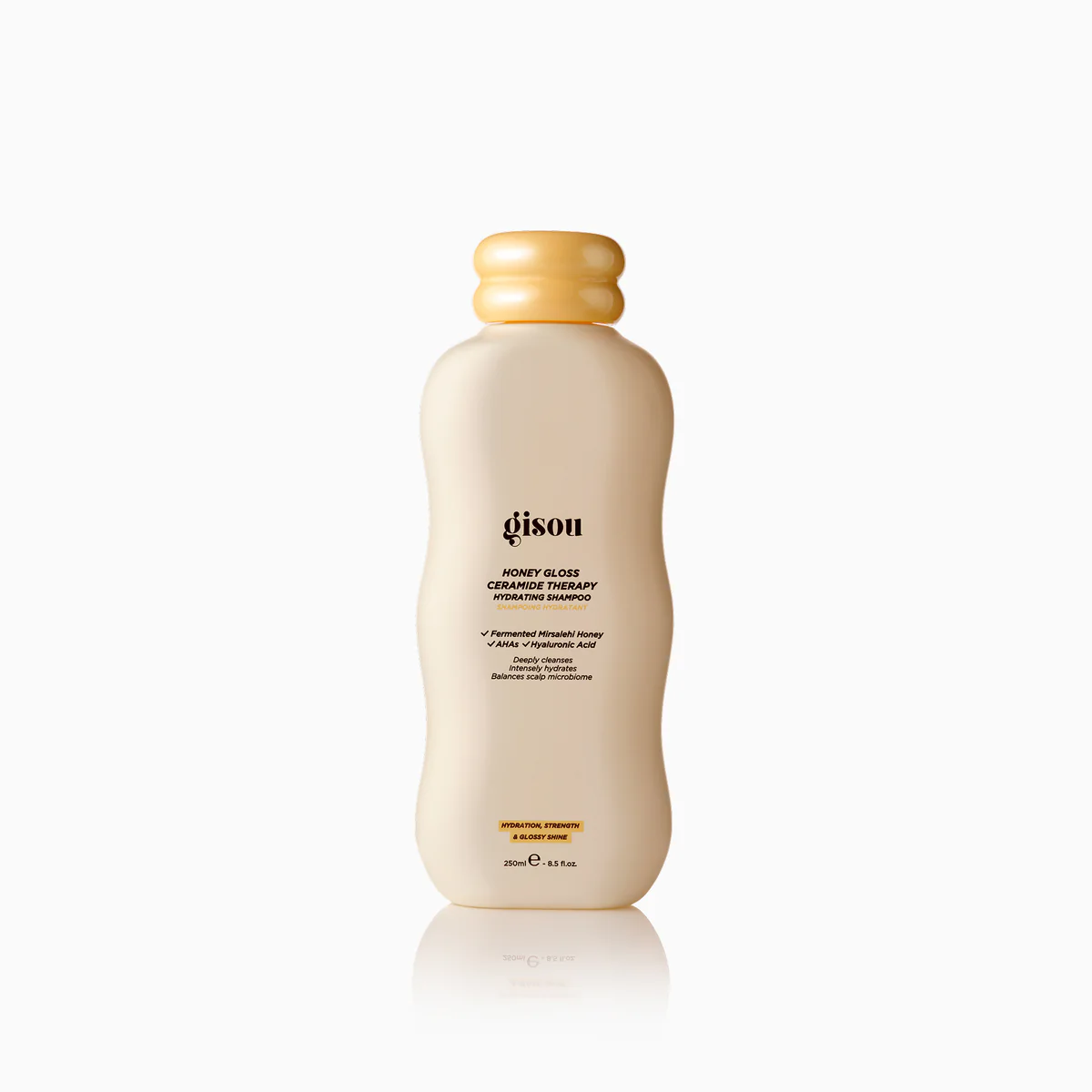 SHAMPOO_PDP_M_D2jpg - shopcosmoprof.com Gisou Honey Gloss Ceramide Therapy hydrating shampoo bottle, beige with a yellow cap (250 ml).