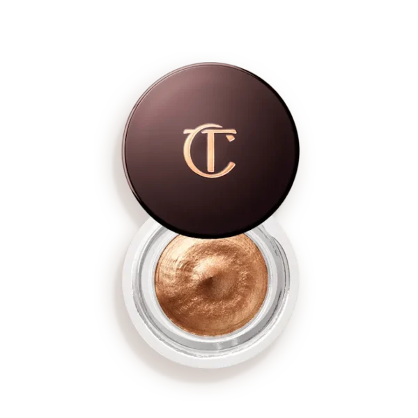 Copper metallic eye shadow in a round pot with a dark brown lid featuring a gold 'TC' logo.