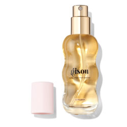 UK200060330_GISOU_1 - shopcosmoprof.com Gold-toned Gisou honey-infused hair perfume bottle labeled vanilla glaze, with a pale pink cap nearby.