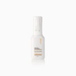 White spray bottle of honey milk active repair leave-in conditioner mist with gold branding on white label