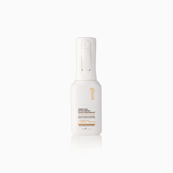 White spray bottle of honey milk active repair leave-in conditioner mist with gold branding on white label