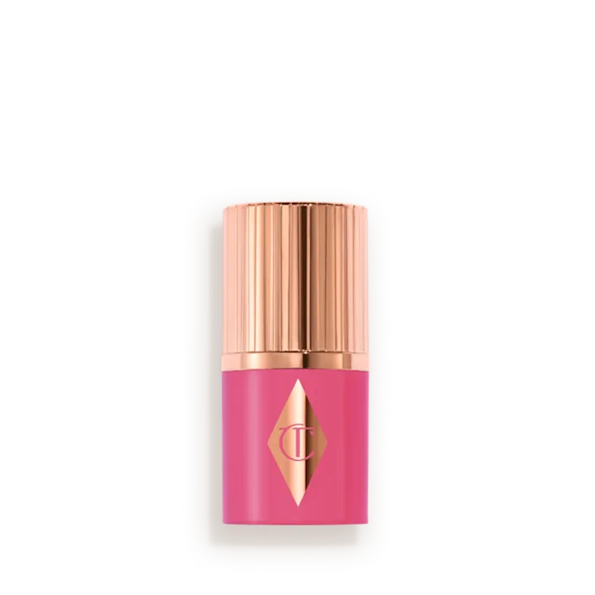Pink lipstick in a metallic rose-gold tube with a pink case and logo, displayed on a light background card (cosmetic product)