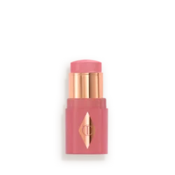 Pink lipstick in a pink case with gold accents and a diamond-shaped logo on the front (cosmetic product).