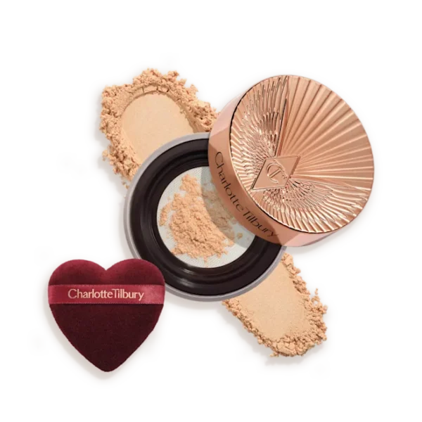 Charlotte Tilbury pressed powder compact with crushed powder and a heart-shaped applicator sponge