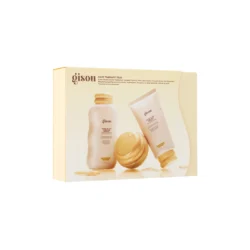 SelfLove26-SET-B-PDP-03-DTCjpg - shopcosmoprof.com Boxed Gisou Hair Therapy Trio set featuring a bottle, a tube, and a jar in soft beige tones with gold lids and honey accents.