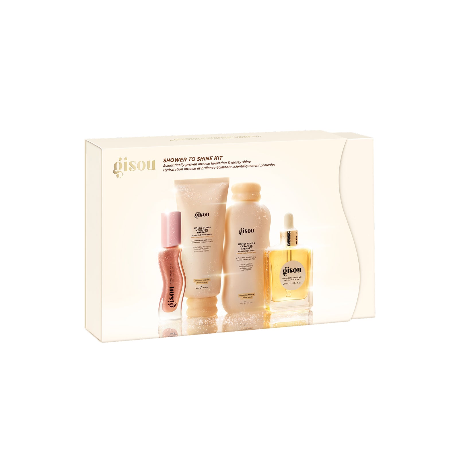 01_a9cc510b-43b1-4cf9-adb0-f612165f8b19 - shopcosmoprof.com Gisou Shower to Shine Kit box displaying assorted beige-pink hair care bottles inside a cream gift box.