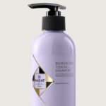 Lavender-colored bottle with a black pump labeled Blonde Code Toning Shampoo by Hadat Cosmetics on a light background.