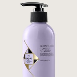 Lavender-colored bottle with a black pump labeled Blonde Code Toning Shampoo by Hadat Cosmetics on a light background.