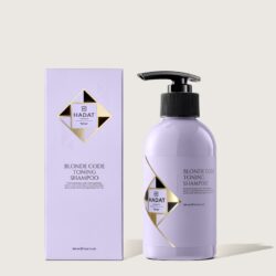Lavender shampoo bottle labeled 'Blonde Code Toning Shampoo' next to matching box on a beige backdrop.