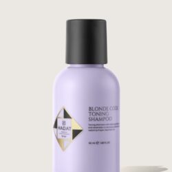 Lilac bottle of Blonde Code Toning Shampoo with black cap and Hadat Cosmetics logo.
