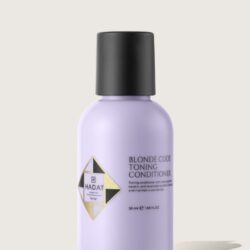 Lavender-toned bottle of Blond Code Toning Conditioner with a black cap, Hadat Cosmetics logo visible on the label, 50 ml