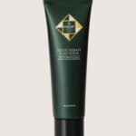 Dark green squeeze tube of Hadat Detox Therapy Scalp Scrub with a black cap, front label visible. Weight 150 g (5.29 oz).