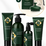 Hadat Detox Therapy hair care set in dark green bottles and tubes on a marble pedestal, with a gift-set circle in the background.