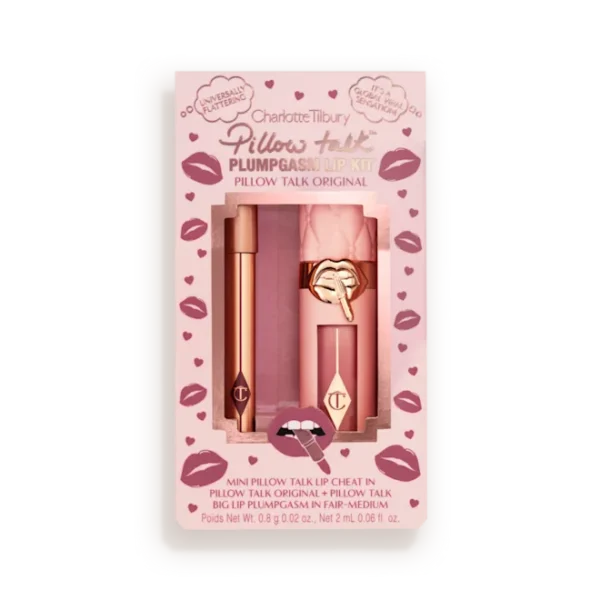 Pink Charlotte Tilbury Pillow Talk lip kit packaging with two rose-gold lip products visible through a window, surrounded by lip-print designs inside a pale tin.