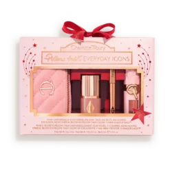 Charlotte Tilbury Pillow Talk Everyday Icons gift set in a pink quilted pouch with makeup items and a red bow box.
