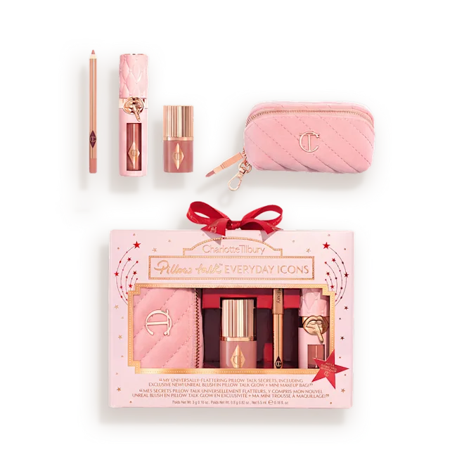 Pink beauty set in a white/pink gift tin with lipstick, pencil, lip balm, compact, and a pink quilted pouch labeled Charlotte Tilbury Pillow Talk Icons.