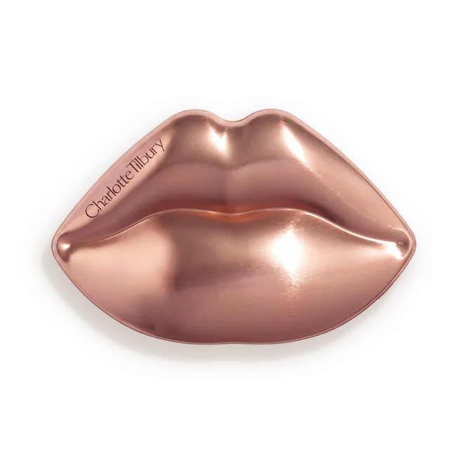 Rose-gold metallic lips-shaped sticker with Charlotte Tilbury branding on a white backing